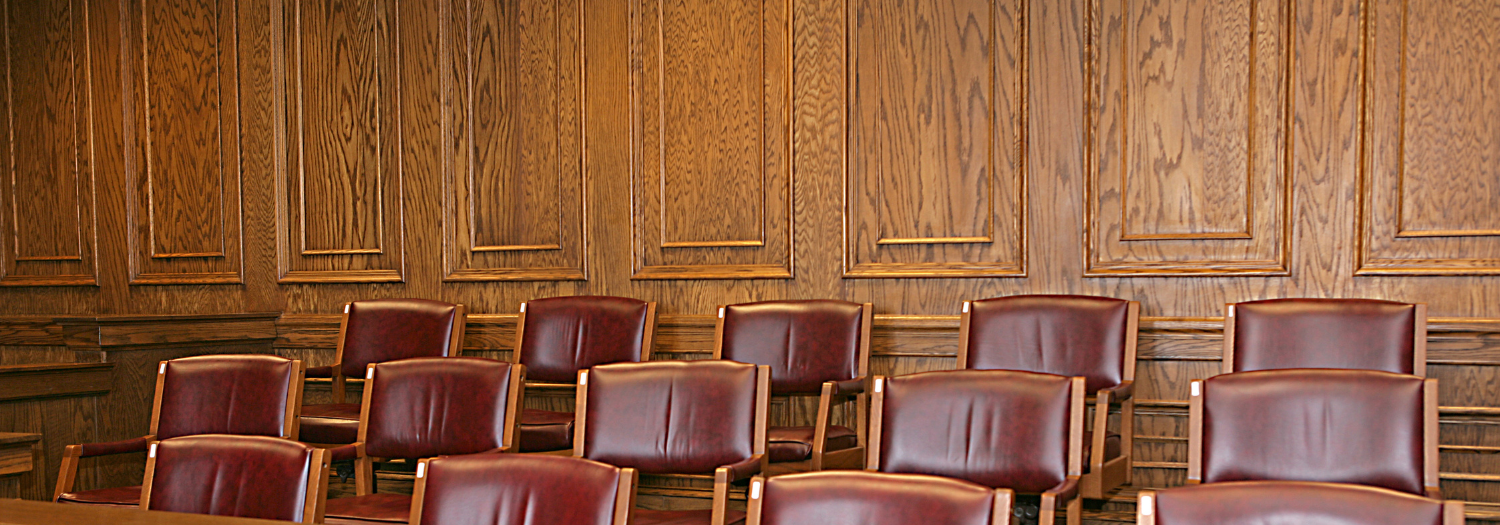 empty chairs in a jury box